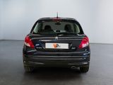 a picture of a car that is parked in a showroom