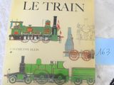 un livre sur lequel figure l'image d'un train