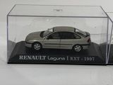 a small toy car in a clear box on a white surface