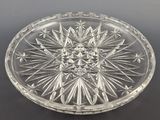 an image of a clear glass plate with a star design on it