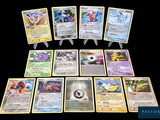 a lot of pokemon cards that are on the table