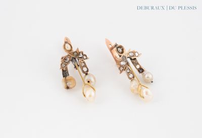 pair of earrings with pearls and diamonds on a white background
