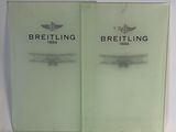 these are two booklets with the words breitling on them
