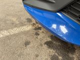 a close up of the front of a blue car
