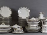 a lot of plates and cups on the table
