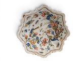 a white plate with a floral design on it