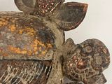 a wooden sculpture of a turtle on a white surface