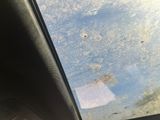 a view of a dirty windshield from inside of a car