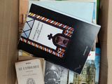 a box full of books that are sitting on the floor