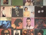a collage of various album covers on a wall