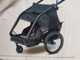 a box with a picture of a child ' s trailer and stroller