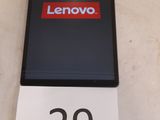 a sign that says lenovo on it next to a phone
