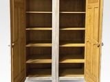 an image of a wooden cabinet with open doors on a white background