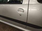 a silver car with a black stripe on the side of it