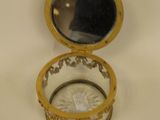 a small yellow box with a mirror inside of it