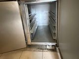 an image of an open refrigerator in a kitchen
