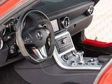 the interior of a red sports car with a steering wheel and dashboard
