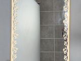 an image of a bathroom mirror with a decorative design on it