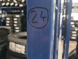 a close up of a stack of tires in a warehouse