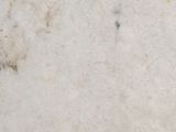 a close up view of a white marble surface