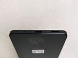 a close up of the back of a black cell phone
