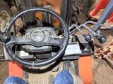 a close up of a steering wheel on a forklift