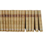 a close up of a row of old books on a white background