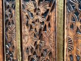 an old wooden door with intricate carvings on it
