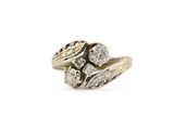 a close up of a gold ring with diamonds on it