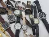 a lot of watches that are sitting on a table