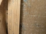 a close up of a piece of wood with writing on it