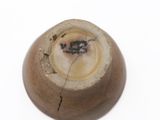 a close up of a vase with a hole in it