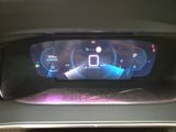 the dashboard of a car with a digital display on it