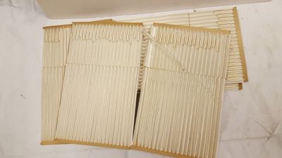 two pieces of bamboo sticks sitting on top of a white table
