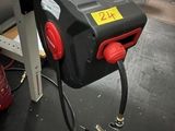 an image of a red and black fire hydrant in a garage