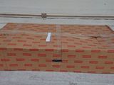 a cardboard box that is sitting on the ground