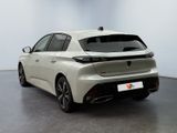 the rear end of a white car in a white room