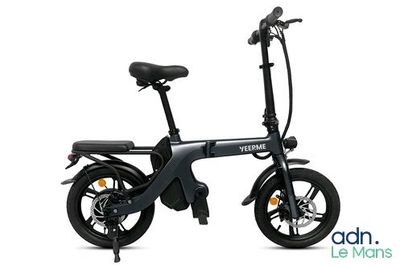 a close up of a black electric bike on a white background