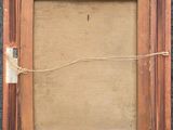 an old picture frame with a rope hanging from it ' s side