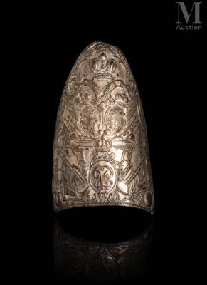 a close up of a silver ring on a black surface