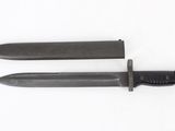 pair of knives on a white surface with a white background