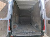 a white van that is parked in the street