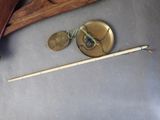 a wooden stick and a metal object on the floor