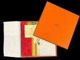 a close up of a box with a napkin and napkins in it