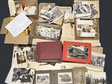 a lot of old photos in a box on the table