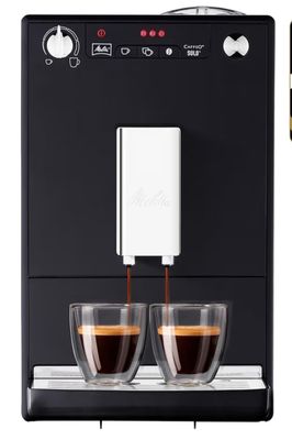 a close up of a coffee machine with two cups of coffee