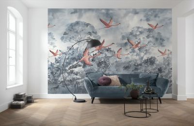 wall mural of a living room with a blue couch and a painting of birds