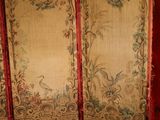 a room divider that has a bird and flowers on it