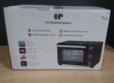 emballage d'un four à micro-ondes noir et blanc posé sur une table en bois