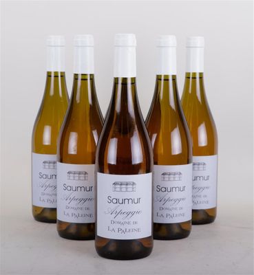 four bottles of wine sitting next to each other on a table